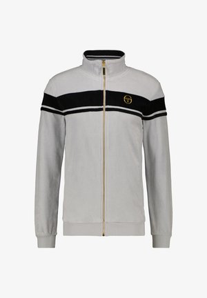 Helehall hall vest, millel on kõrge kaelus, must sametist triip rinna peal ja kuldne logo aktsent. Ribakäised ja alläär.