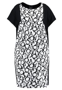 Šaty s krátkým rukávem, které mají bílý přední díl s černými textovými vzory, pevné černé rukávy a volný střih. Vyrobeno z hladké látky.