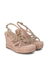 Sandali con zeppa di un rosa tenue, con suola in juta intrecciata. Design con cinturini che presenta dettagli in gioiello nella parte superiore e una cinghia alla caviglia regolabile.