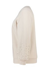 Crème kleurige sweatshirt met een textuurstof, versierd met kleine parels op één mouw en een geribbelde zoom.