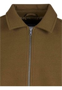 Brown, textured jacket with a zip-up front, featuring a pointed collar and a smooth interior lining. Simple design and durable material.