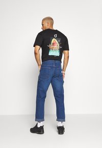 Lee CARPENTER - Calças de ganga de perna direita - blue denim
