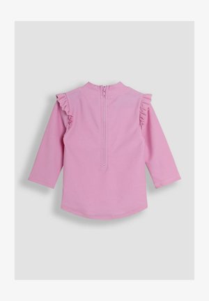 Maglietta rosa a maniche lunghe con dettagli arricciati sulle spalle e una cerniera sul retro, caratterizzata da una texture liscia e un orlo arrotondato.