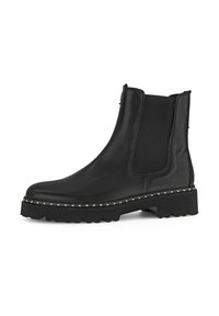 Bottes noires en cuir à cheville avec panneaux élastiques sur les côtés, bout rond et semelle plateforme chunky ornée de petites clous métalliques.