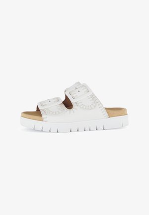 White synthetic slide sandal with two adjustable straps, contrasting stitching, and a cushioned insole on a textured rubber outsole.