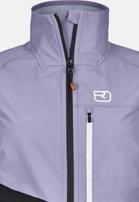 Light purple jacket featuring a high collar, black zipper details, and a white logo. Includes textured fabric and contrasting black accents.