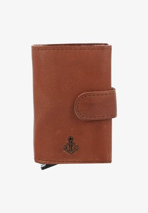 Brown leather wallet with a fold-over design, featuring a metal anchor accent and visible stitching detail. Compact and textured surface.
