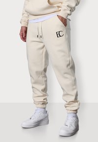 EC LOGO - Jogginghose - beige