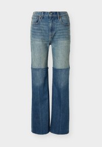 Τζιν παντελόνι διχρωμίας με πιο ανοιχτόχρωμο πάνω μέρος και πιο σκούρο κάτω μέρος, κλασικός σχεδιασμός με πέντε τσέπες και ίσια γραμμή στο πόδι.