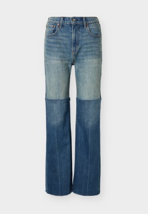 Τζιν παντελόνι διχρωμίας με πιο ανοιχτόχρωμο πάνω μέρος και πιο σκούρο κάτω μέρος, κλασικός σχεδιασμός με πέντε τσέπες και ίσια γραμμή στο πόδι.