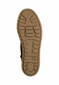 Rubber sole with textured tread, featuring “soft FLEX” branding. Earthy tan color with a mixture of solid and patterned sections.