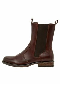 Botte chelsea en cuir marron avec des panneaux latéraux élastiques, bout arrondi et une semelle extérieure en caoutchouc marron texturé. Comprend des languettes pour un enfilage facile.
