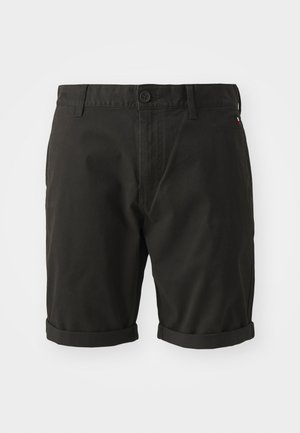 Bermuda nera in cotone dal taglio dritto. Presenta una chiusura con bottone, risvolti e dettagli di design minimalisti.