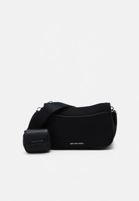 Black shoulder bag with a smooth finish, featuring a single strap, a zip closure, and a small pouch, embossed with brand name.