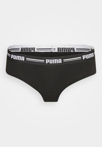 Crne gaće s bijelim pojasom na kojem se ponavlja tekst "PUMA" i horizontalnim prugama. Glatka tkanina s prilagodljivim dizajnom.