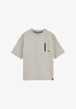 Svetlo bež majica s kratkimi rokavi z majhnim navpičnim žepom na zadrgo in logotipom "Salty Dog" na prsih.