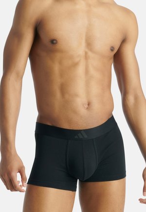 Schwarze Boxer-Briefs aus einem glatten, elastischen Stoff. Verfügt über einen breiten elastischen Bund mit einem dezenten Logo und einer konturierten Vorderseite.