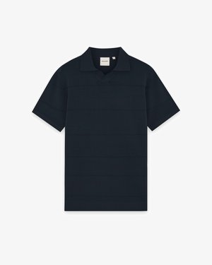Navyblauw poloshirt met korte mouwen, een klassieke kraag en een klein merkembleem aan de binnenkant van de halslijn.