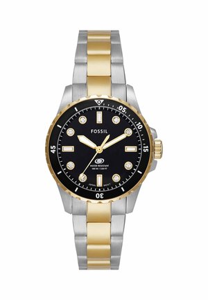 Edelstahl- und goldfarbene Fossil-Armbanduhr mit schwarzem Zifferblatt, Kristall-Stundenmarkierungen und Wasserdichtigkeit bis 100 Meter.