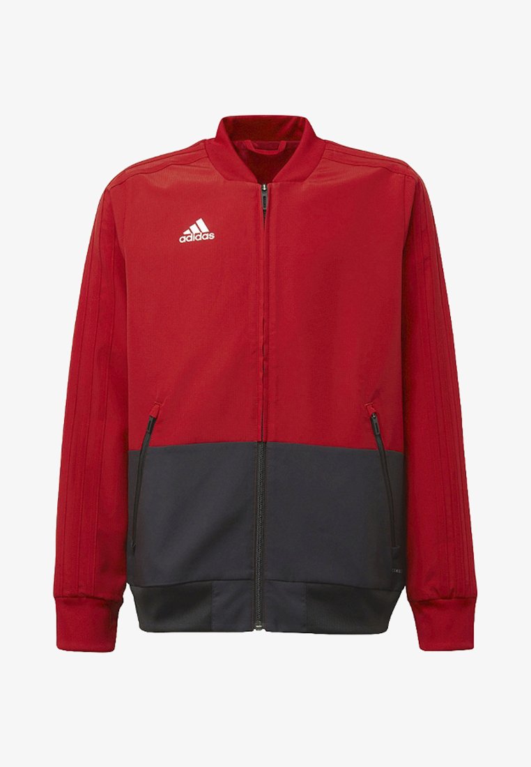 Red and navy zip-up jacket made of smooth fabric. Features a stand collar, side zip pockets, and three-stripe detail on sleeves.