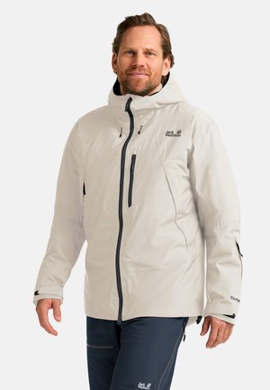 Veste imperméable gris clair avec capuche, dotée de poches zippées noires et de poignets ajustables. Design épuré, conçue pour une utilisation en extérieur.