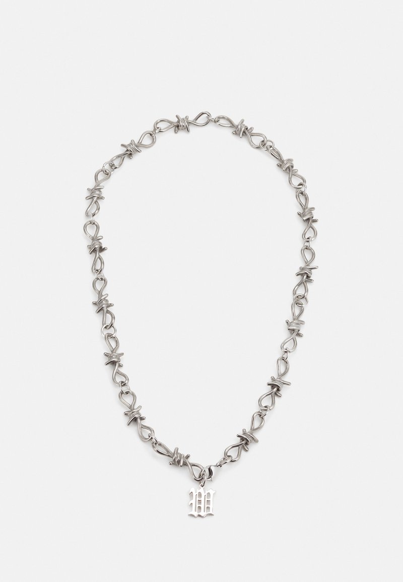 Silver chain necklace featuring intertwined links and a decorative 'W' pendant. Smooth metal texture with a shiny finish.