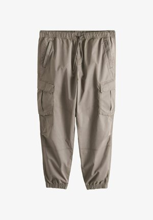 Šviesiai rudos spalvos krovinių kelnės su elastinga juosmens juosta, raišteliu, keliais kišenėmis ir elastinėmis apačiomis ties čiurnomis.