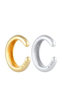 Cuffs de oreja curvados en oro y plata, con acabado metálico pulido, marcados con "925," mostrando colores distintos y una textura suave.