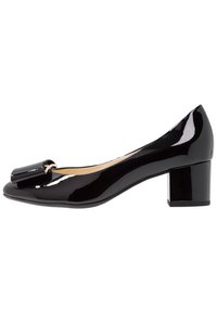 Svart lackläder låga klackpumps för kvinnor med rund tå och dekorativ rosett på framsidan.