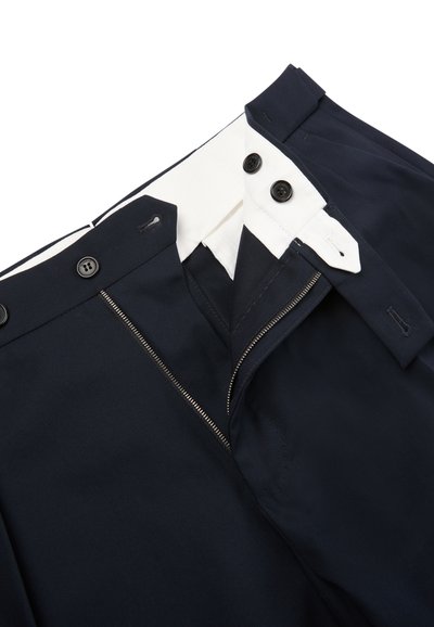 Navy blue trousers with a zip fly and dual black buttons. Features a contrasting white inner lining and subtle stitching details.