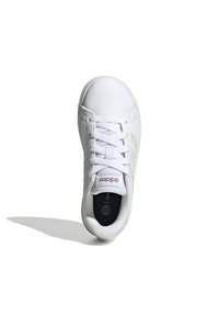 White sneaker with a smooth synthetic upper, six eyelets, and white laces. Features a padded collar and three light gray stripes on the side.