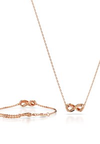 Set aus roségoldener Unendlichkeitshalskette und -armband, mit verbundenen Unendlichkeitssymbolen, feinen Kettenverbindungen, glatter Oberfläche und Details der Verschlussmechanik.