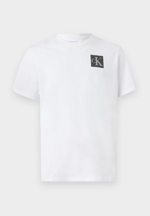 White cotton t-shirt with a crew neckline, short sleeves, and a black "cK" logo on the left chest area. Classic fit and smooth texture.