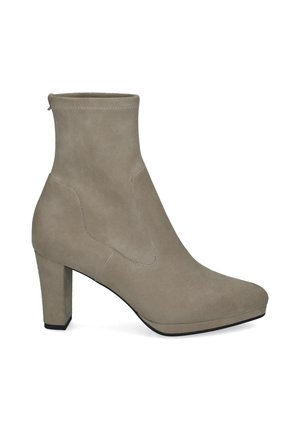 Beige suede ankle boot with a block heel and rounded toe, featuring visible stitching and a slip-on upper design.