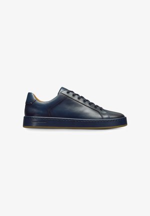 Navy leather sneaker with a rounded toe, lace-up closure, and contrasting brown inner lining. Sturdy sole with subtle stitching detail.