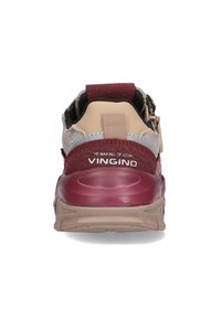 Rear view of multicolored sneaker featuring maroon, beige, and gray materials. Thick sole with textured accents and heel tab. Brand logo visible.