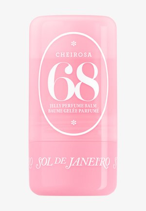 Contenitore cilindrico rosa del balsamo profumato in gel Sol de Janeiro Cheirosa 68 con testo bianco ed elementi decorativi.