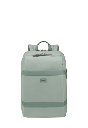 Light green backpack made of smooth synthetic material, featuring a front pocket, adjustable straps, and silver hardware accents.