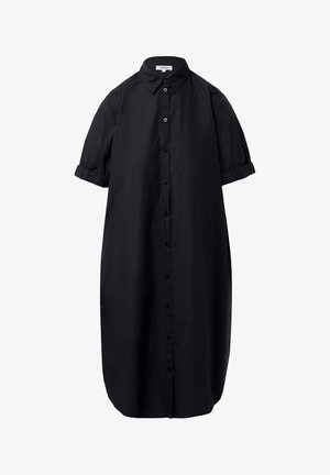 Must must dress, mis a kerge kangas, varustatud nööpide ees, lühikeste rulli varrukatega ja õlavarrega harkhinna, et saavutada vaba sobivus.