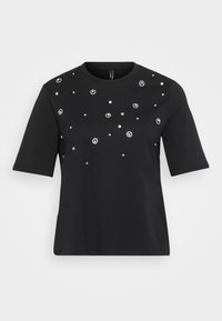 T-shirt noir à manches courtes en coton, présentant des embellissements circulaires en argent disposés de manière éparse sur le devant.