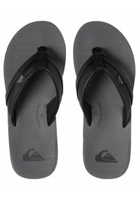 Flip-flops negre cu tălpi gri texturate, având un design de bretele în formă de Y. Fabricate cu tehnologia Hydrobound. Detaliu logo pe talpă.