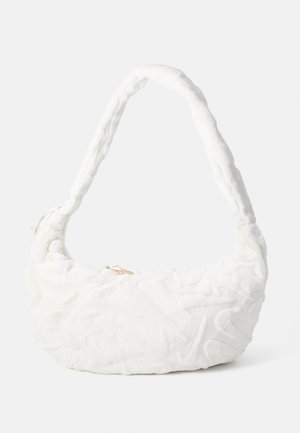 White quilted handbag with a plush texture, curved shape, and a thick, braided handle. Features a gold zipper accent.