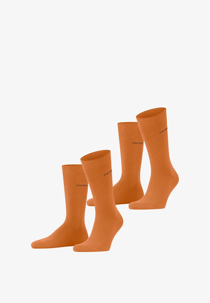 Four pairs of orange socks made from a smooth fabric, featuring a ribbed texture and a logo printed near the top.