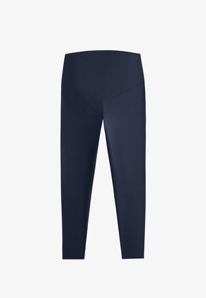 Leggings bleu marine taille haute, longueur intégrale, avec un détail de couture en forme de V à la ceinture avant.