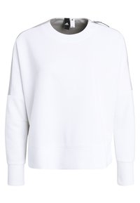 Sudadera blanca de manga larga y cuello redondo. Presenta un corte holgado y un sutil detalle de costura en los hombros. Textura de tela suave.