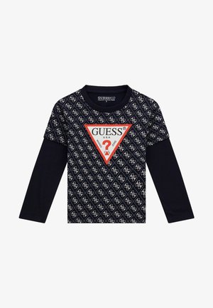 ilgomis rankovėmis marškiniai tamsiai mėlynos spalvos su geometriniu logotipo raštu ir raudonu trikampiu logotipu centre. Pagaminti iš ekologiškos medvilnės pluošto.