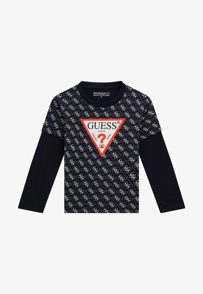 Tumesinine pika varrukaga särk, millel on geomeetriline logo muster ja punane kolmnurkne logo keskel. Valmistatud orgaanilisest puuvillakiust.