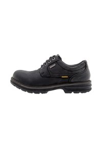 Black leather shoe with rounded toe, lace-up design, textured surface, and a durable outsole featuring grooves for traction.