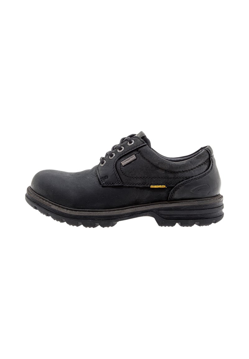 Black leather shoe with rounded toe, lace-up design, textured surface, and a durable outsole featuring grooves for traction.