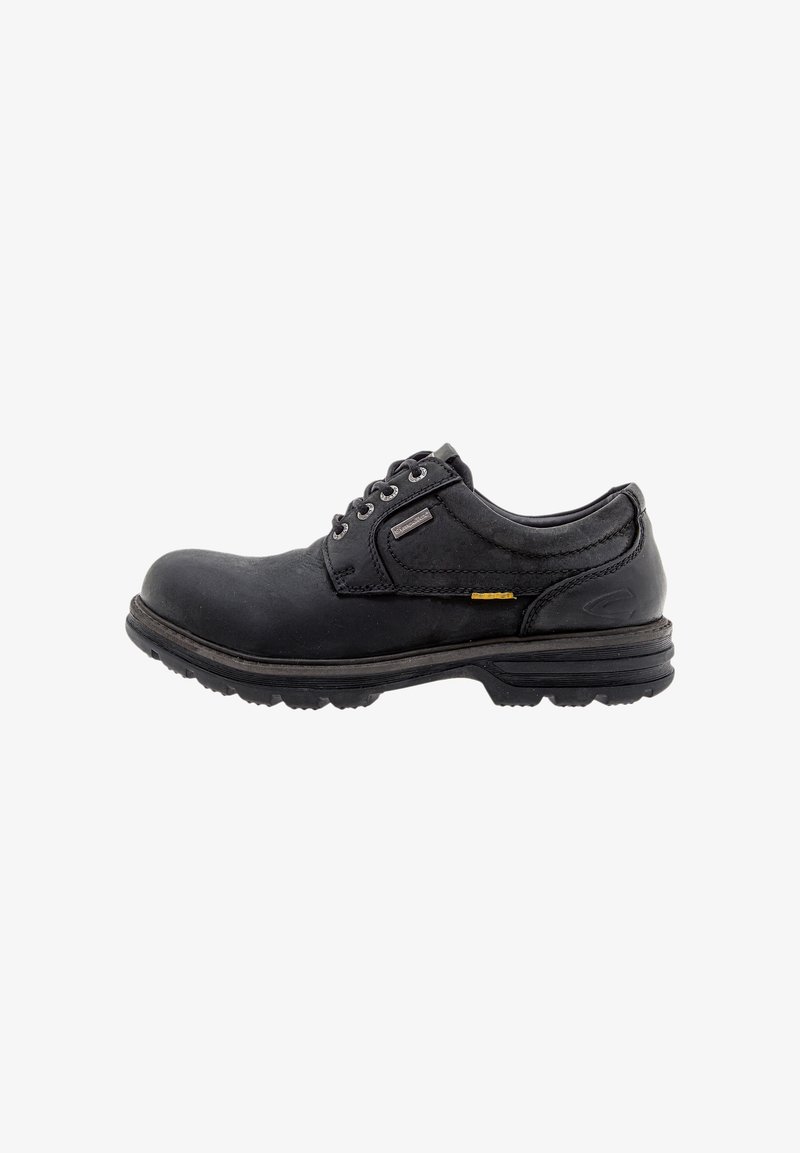 Black leather shoe with rounded toe, lace-up design, textured surface, and a durable outsole featuring grooves for traction.